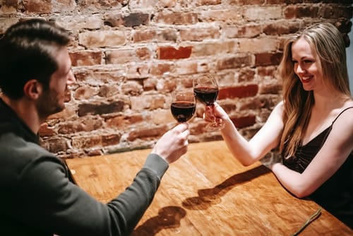 holding a wine glass
